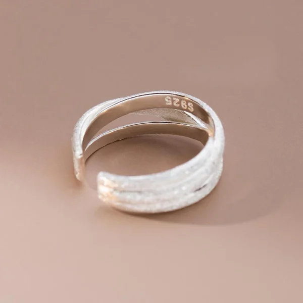 silver color scrub lines crossed geometric cuff ring