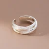 silver color scrub lines crossed geometric cuff ring