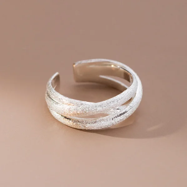 silver color scrub lines crossed geometric cuff ring