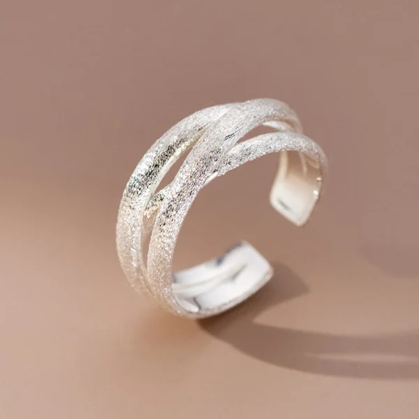 silver color scrub lines crossed geometric cuff ring