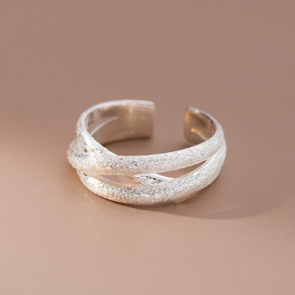 silver color scrub lines crossed geometric cuff ring